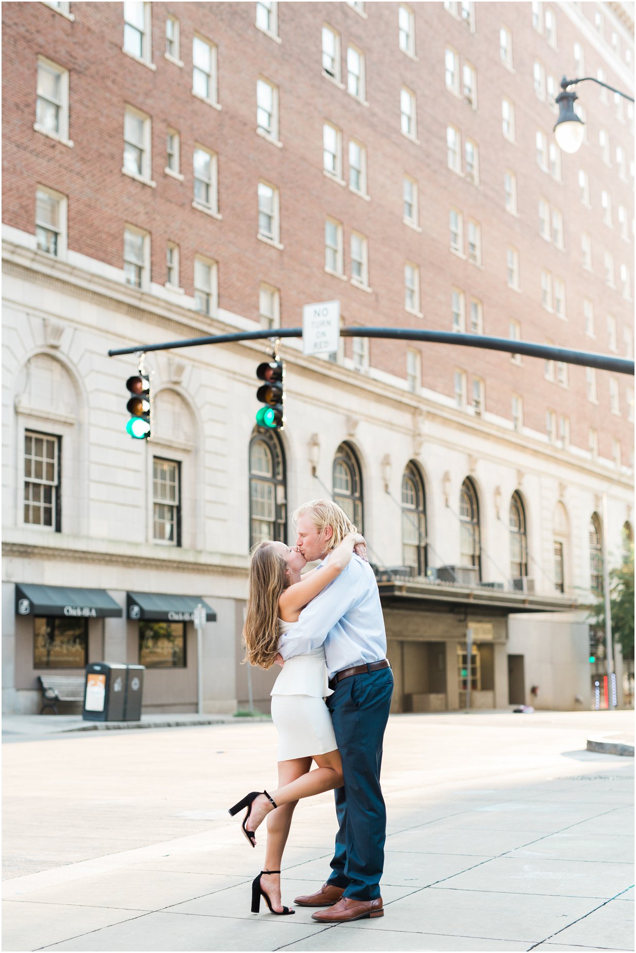 Couple kissing in downtown Raleigh